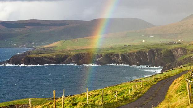 rainbow over coastline